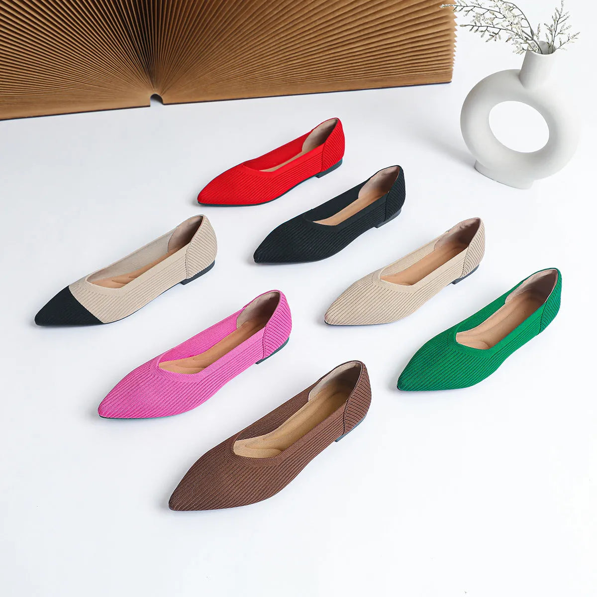 Women's apricot knit pointed toe flat ballet pumps with a rubber sole, shown from the side.