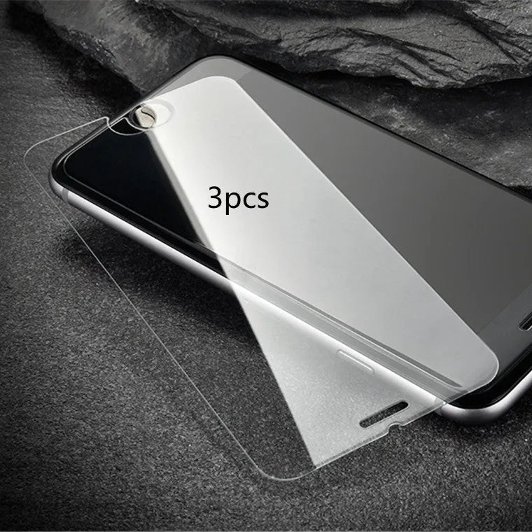 Tempered glass screen protector with 9H hardness for smartphones on a clean surface.
