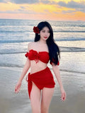 Red women's bikini swimsuit with puff sleeve skirt design and briefs-style bottom