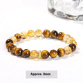 Yellow tiger-eye gemstone bracelet with 8mm round beads in a Jinba geometry design.