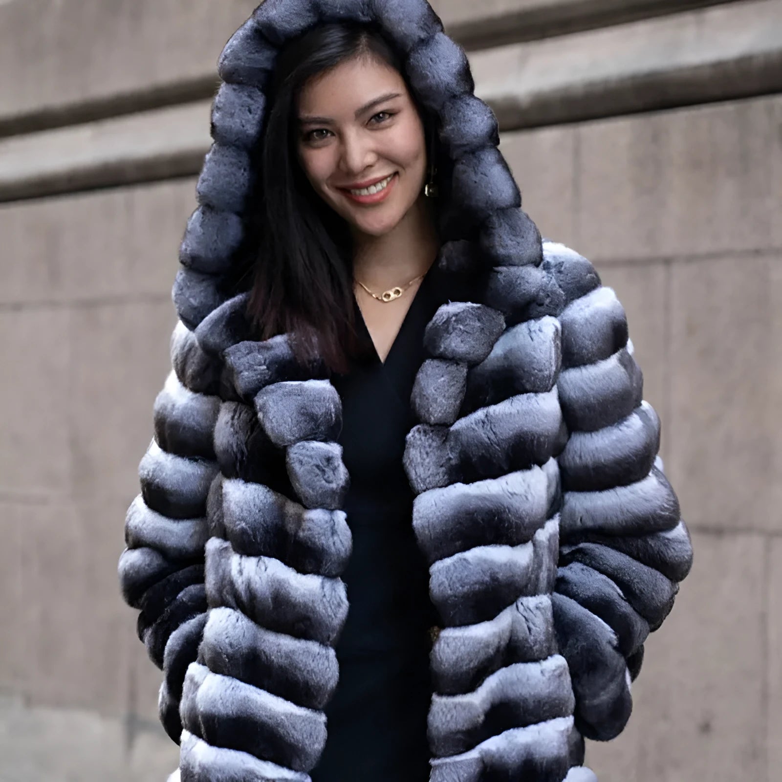 Women's zebra stripe pattern artificial mink faux fur mid-length coat on a hanger.