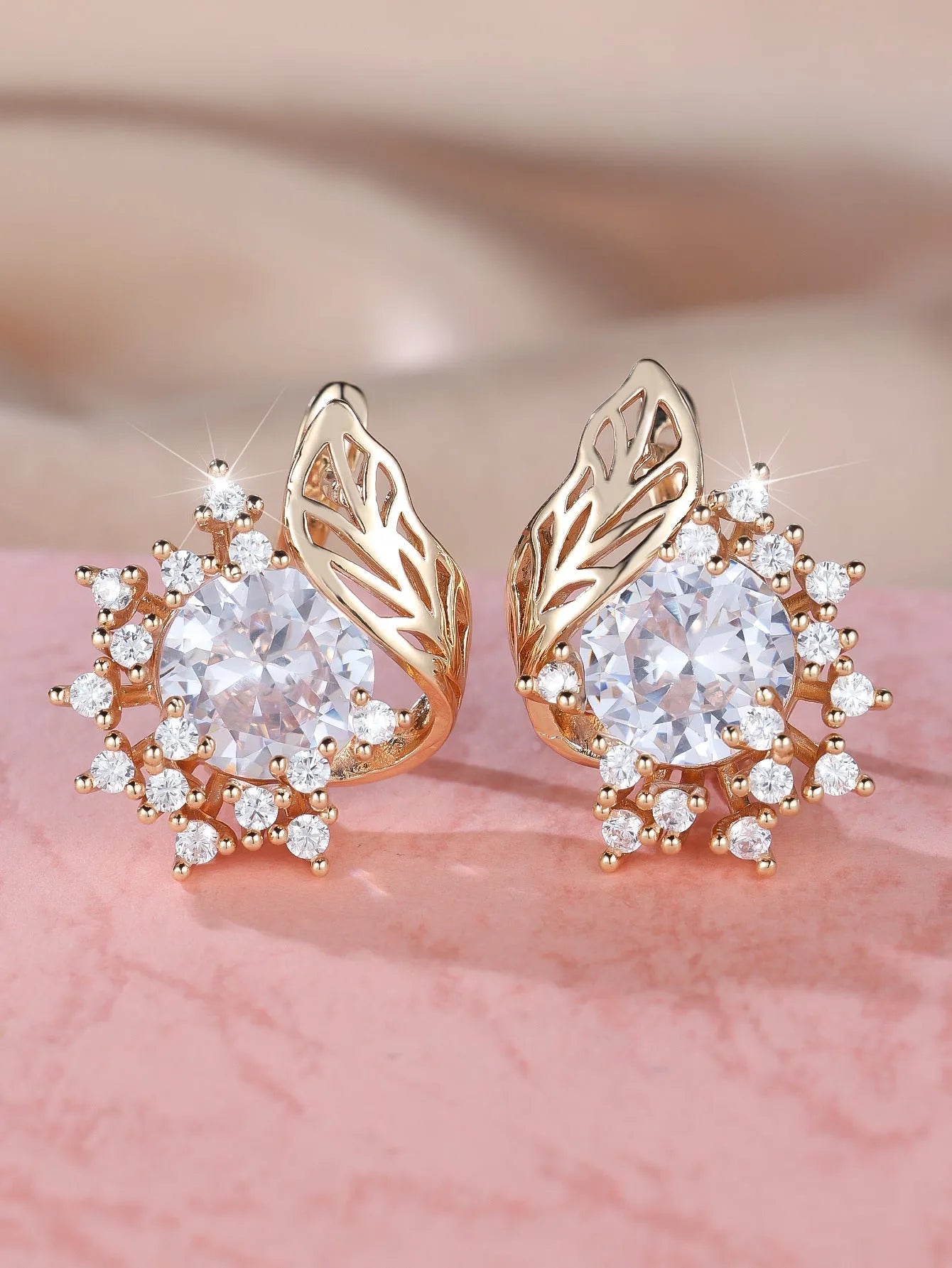 Round flower feather earrings with zircon stones in champagne gold finish, approximately 2-3cm diameter