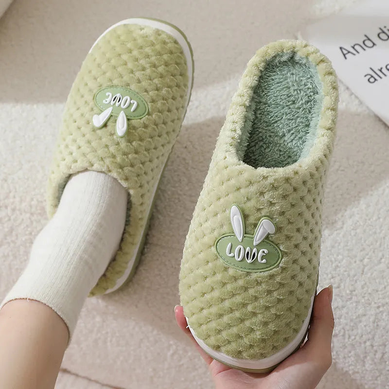 Women's rabbit plaid design artificial fur slippers with a thick rubber sole in various colours.