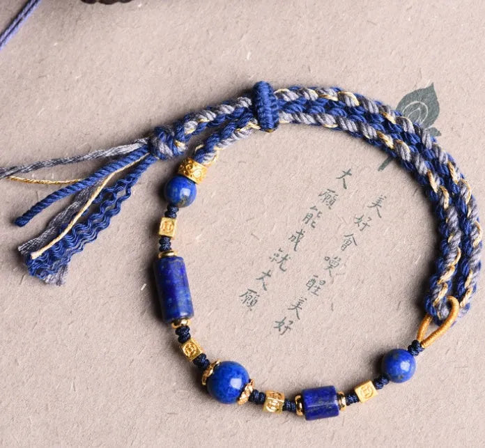 Hand-woven ethnic watch bracelet in flexible wire, showing Hongfei Ebony and Lapis Lazuli colour options.