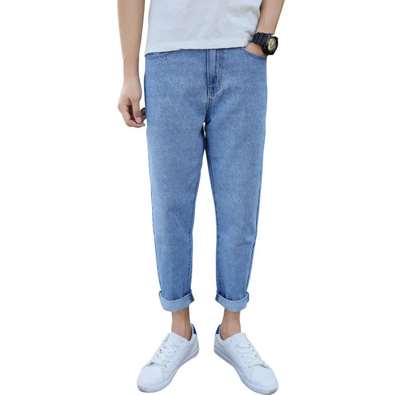Men's black loose straight cotton jeans with harem-style fit on hanger