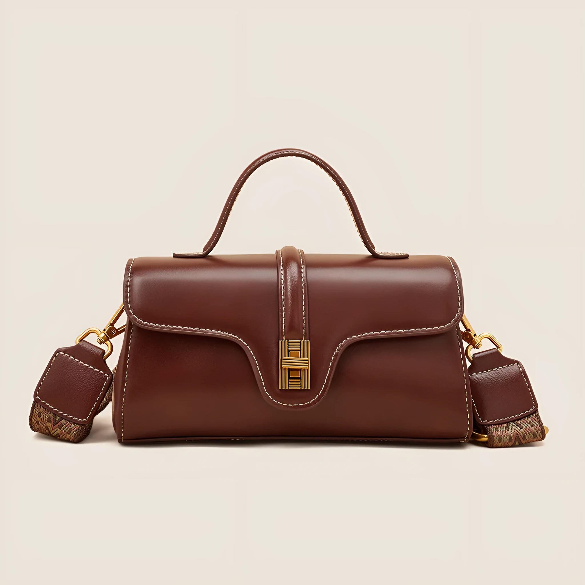 Brown Cambridge leather messenger bag with lock closure showing clamshell opening and internal organisers
