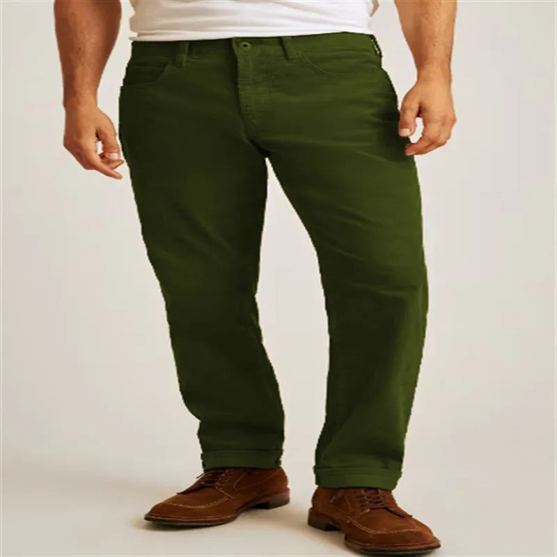 Loose fit solid green corduroy casual straight leg trousers on a mid-waist.