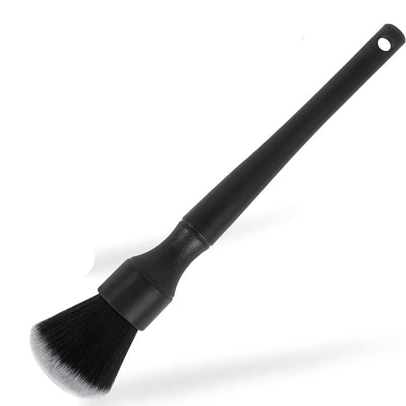 Black car detailing brush with ultra-soft pig hair bristles and a plastic handle.