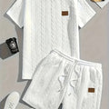 Men's black two-piece sports set with short sleeve T-shirt and matching shorts featuring patch design