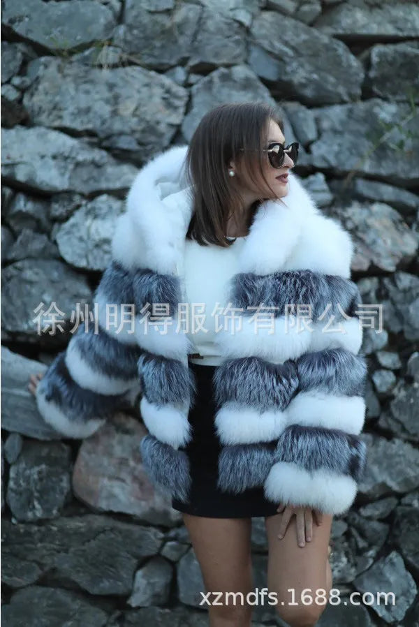 Loose-fitting women's hooded coat in artificial fur, shown in brown and silver fox colours.
