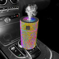 Car humidifier with diamond-shaped water reservoir in various colours, showing USB power connection