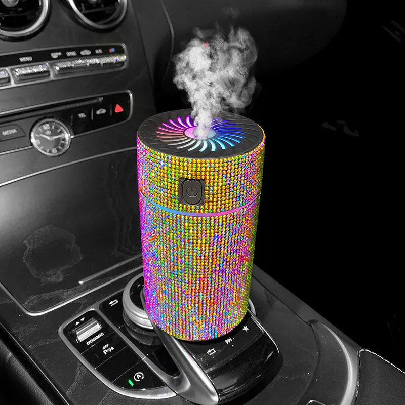 Car humidifier with diamond-shaped water reservoir in various colours, showing USB power connection