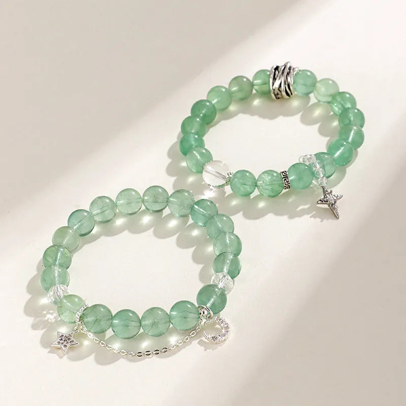 Green fluorite bracelet with star and moon princess designs on wrist