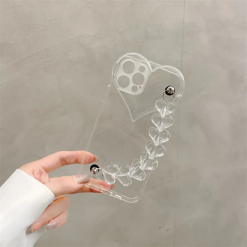 Transparent soft TPU iPhone case with a decorative silver love bracelet chain attached.