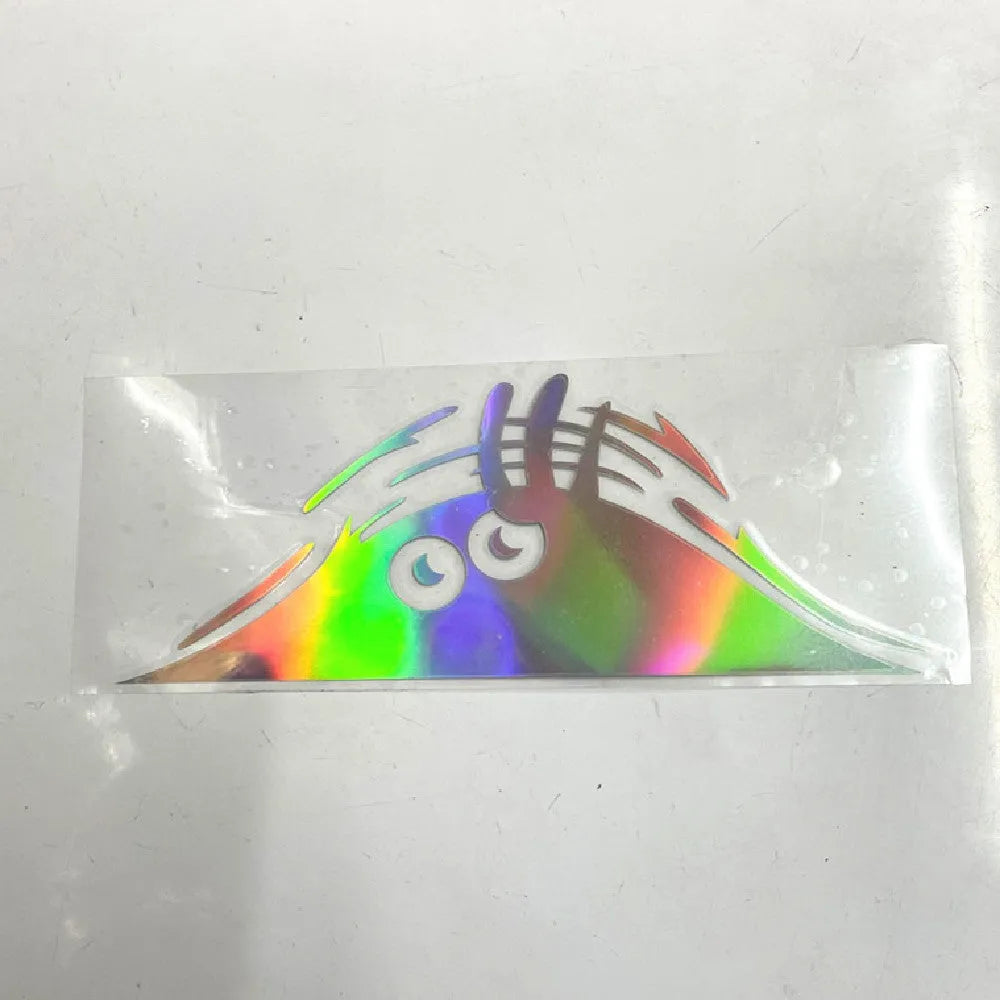 Four self-adhesive body sticker designs on skin including black and colourful smiley faces.