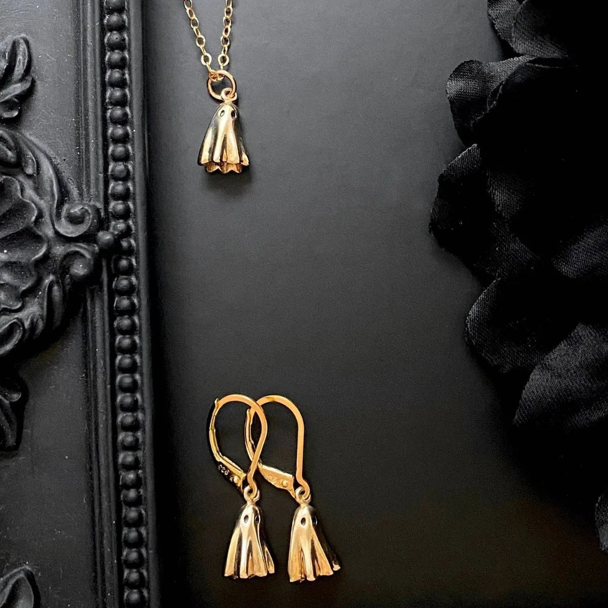 Ghost motif pendant necklace on a twisted stainless steel chain, available in Cable, Figaro, or Mini Staple chain styles.