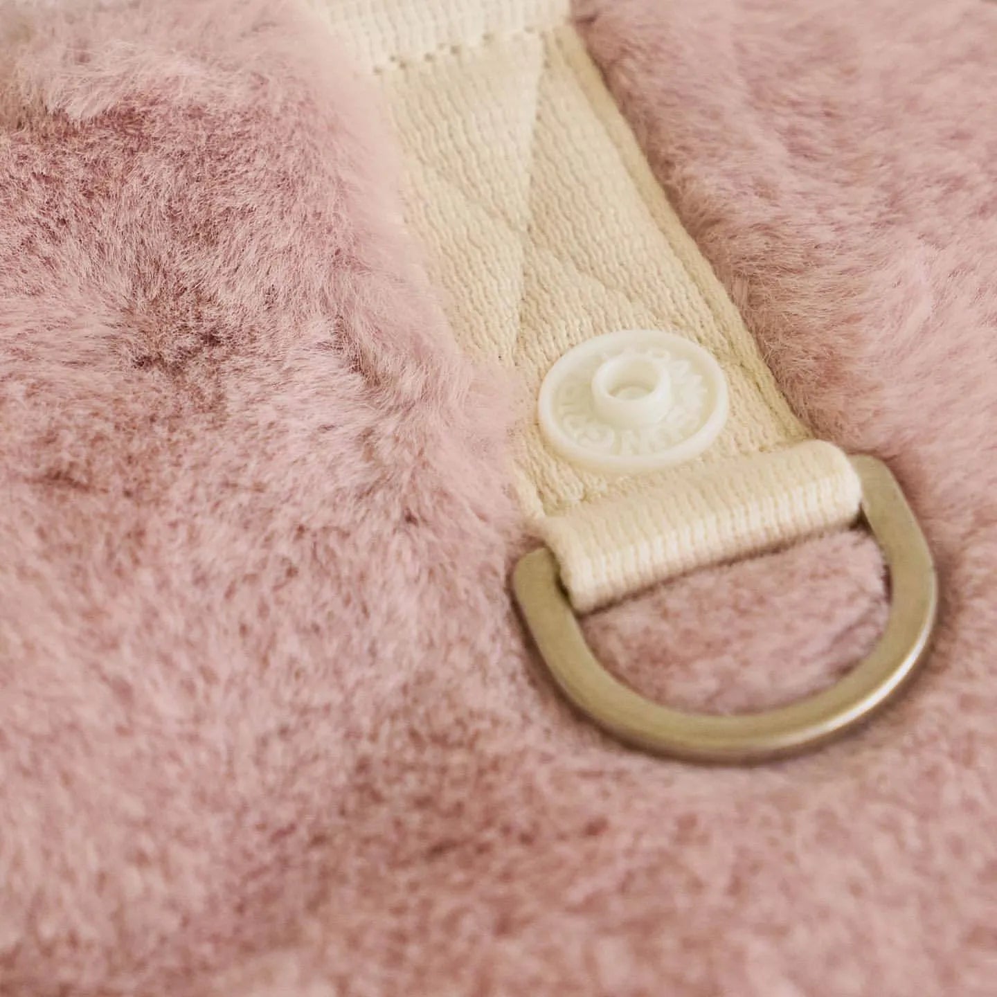 Light pink polyester coat for a dog, showing casual styling and a size range from XS to XL.