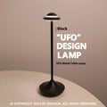 Modern metallic UFO-shaped table lamp with touch controls in black, gold, or grey finish.