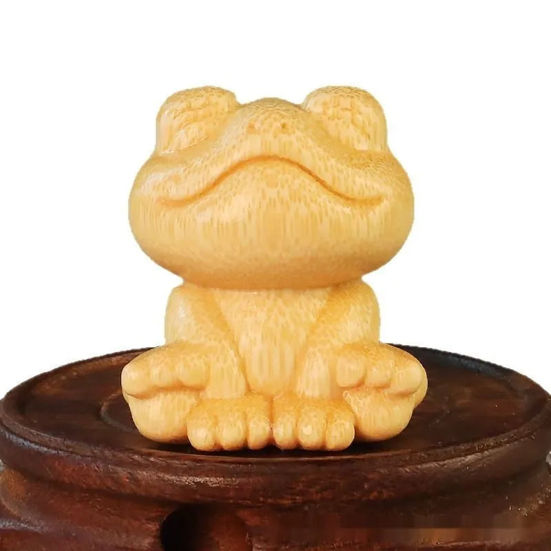 Solid bamboo smiling frog carving ornament with cartoon style measuring 5cm tall