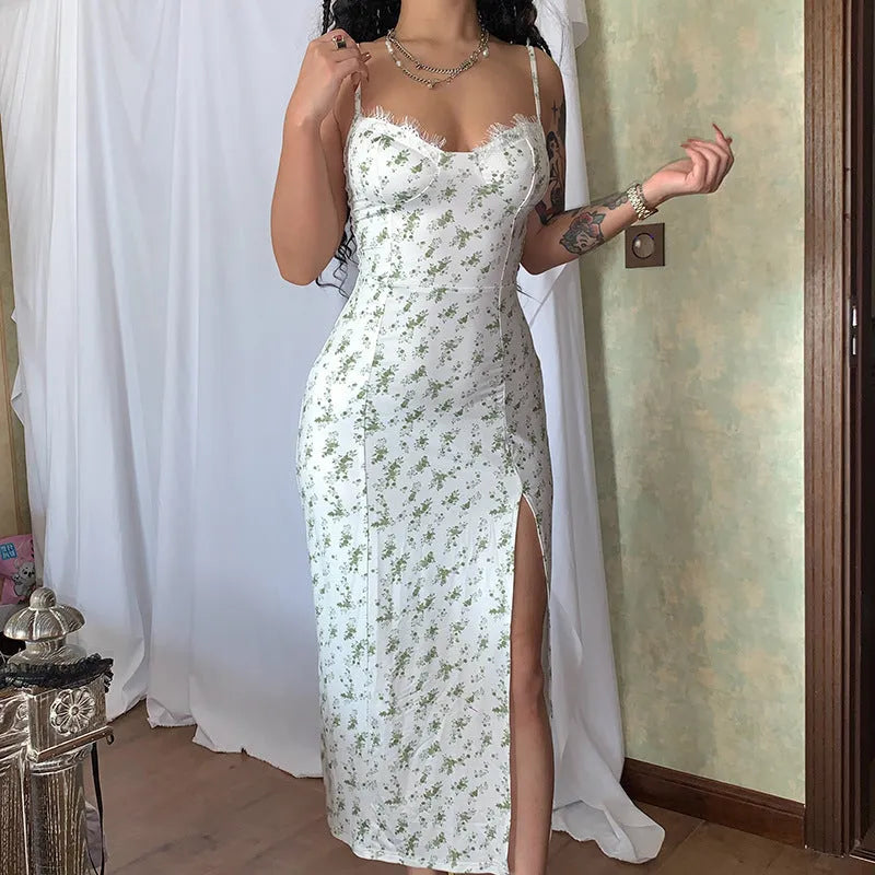 Blue lace floral print long dress on a model, showing side slit and suspender straps.