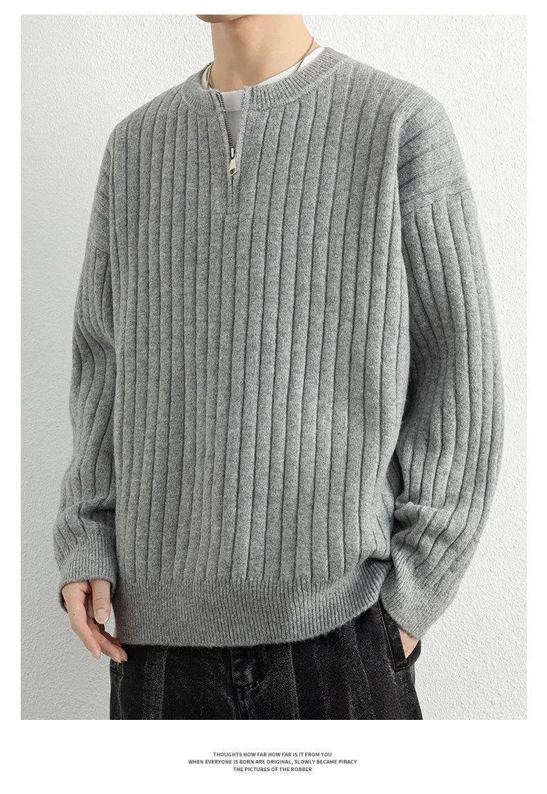 Men's grey half zip loose knit sweater with textured fabric and long sleeves