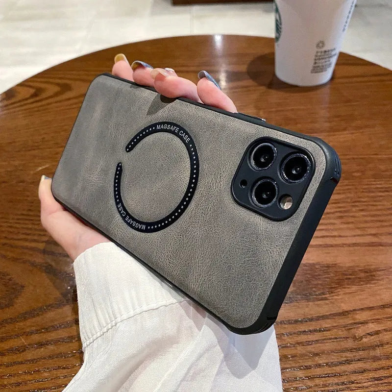 Black imitation leather magnetic charging case for iPhone on a table