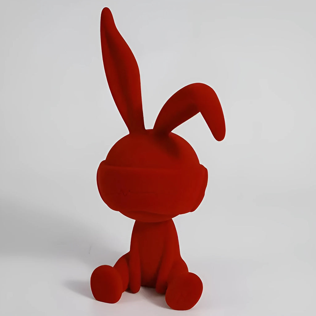 Resin rabbit table ornament with a suede blindfold in green, blue, or red colour options.