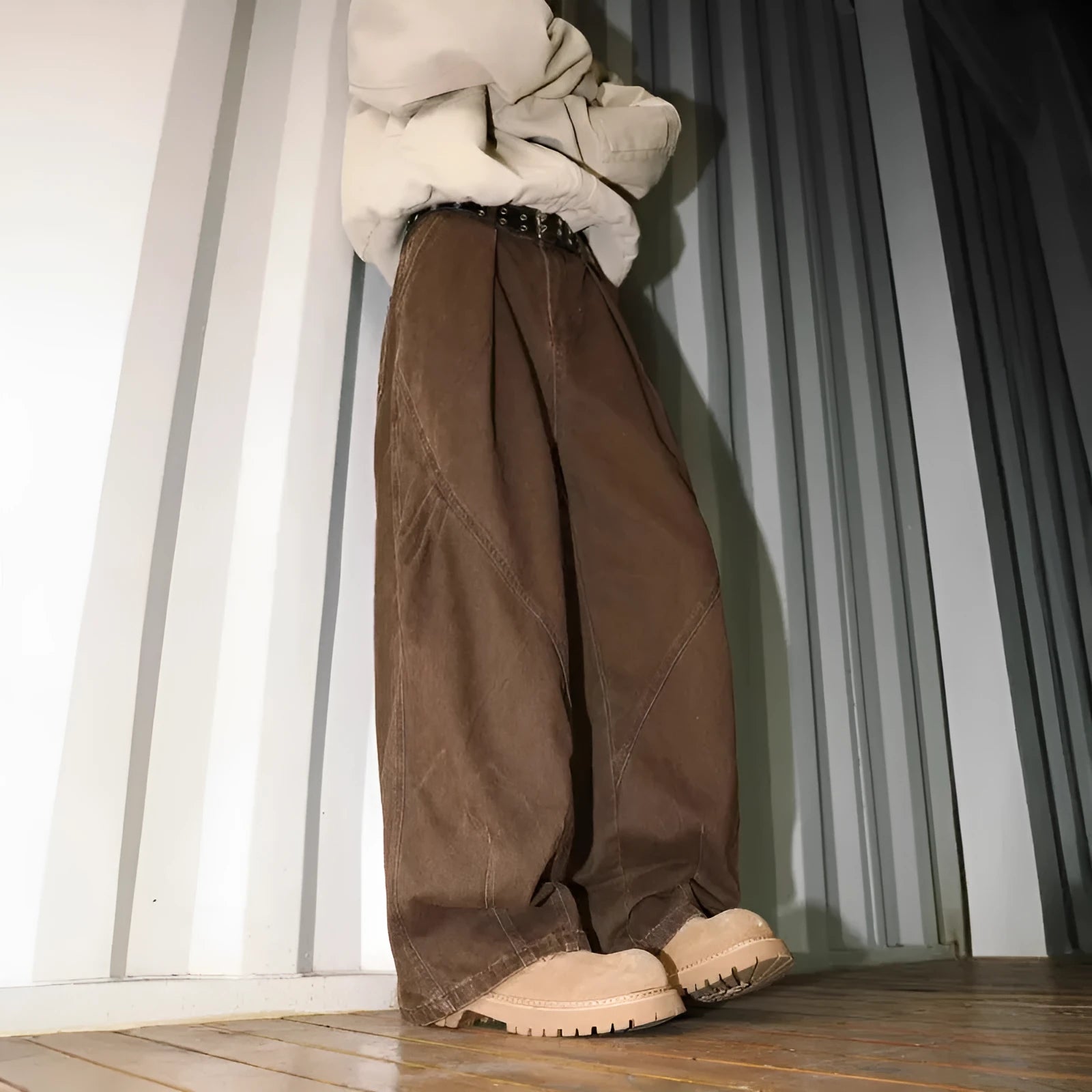 Men's loose straight-leg pleated trousers in apricot stripes on a mid-waist fit model.