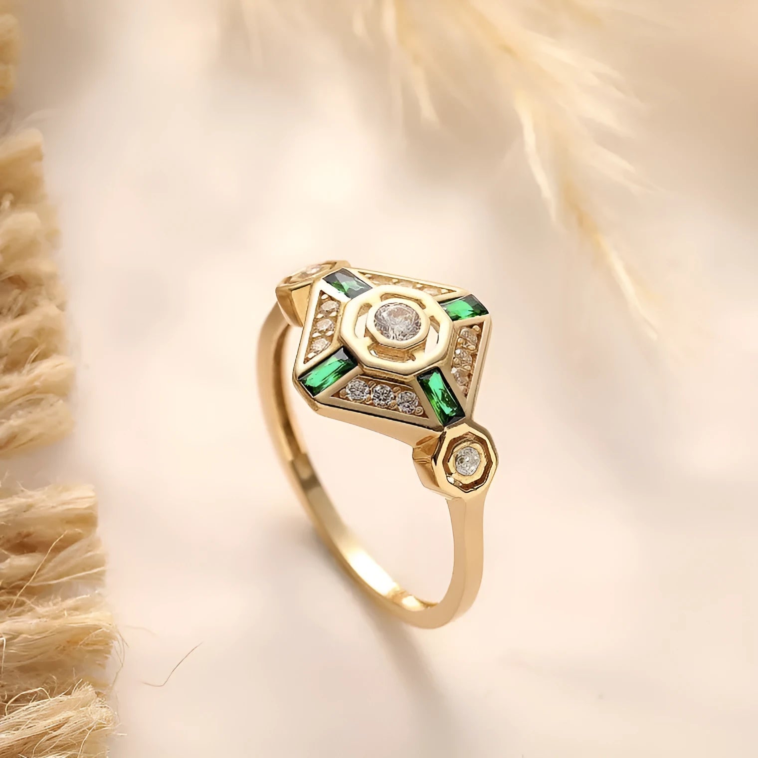 Square-cut emerald green gemstone ring on a finger, showing geometric ins-style design.