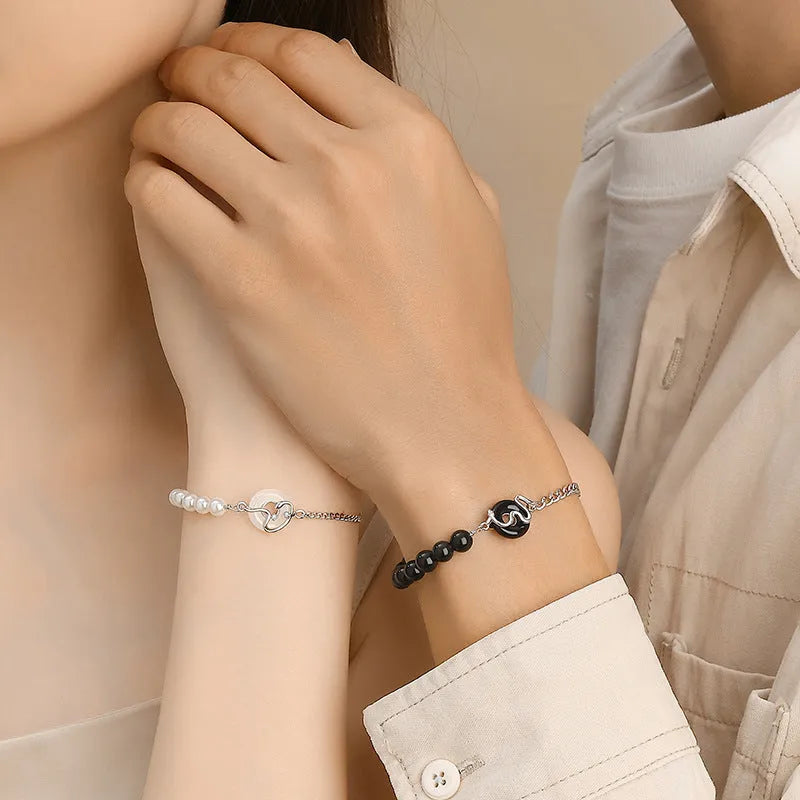 925 sterling silver couple bracelet with obsidian pearl, snake motif, and peace buckle clasp in New Chinese style.
