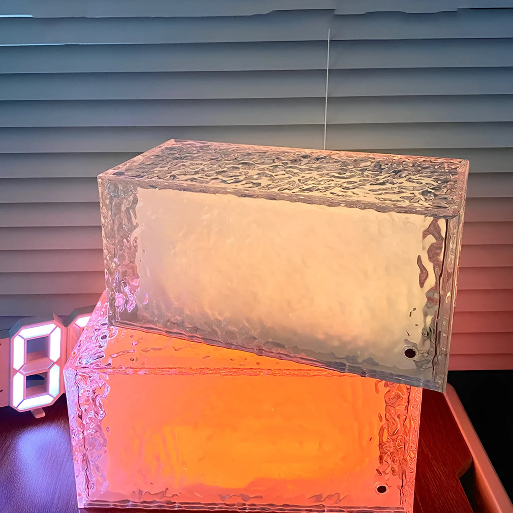 Geometric acrylic night lamp showing coloured illumination patterns from multiple angles