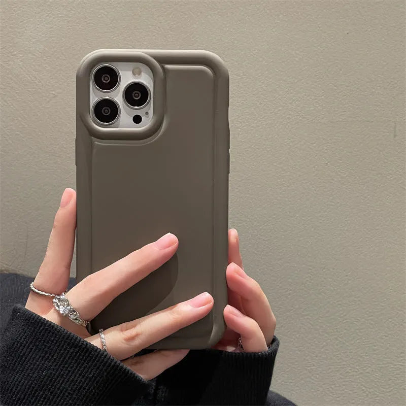 Silicone soft phone case for iPhone, available in multiple colours including black and khaki, flexible protective cover
