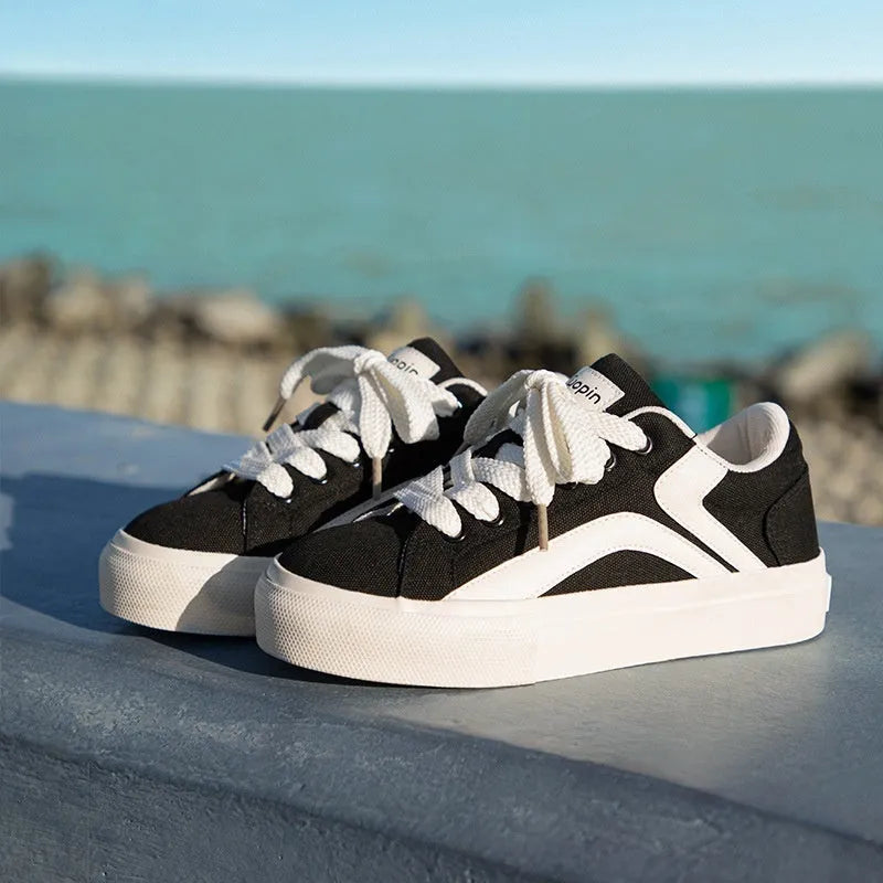 Women's low-top board shoes with vulcanised rubber sole and synthetic leather upper in multiple colour options