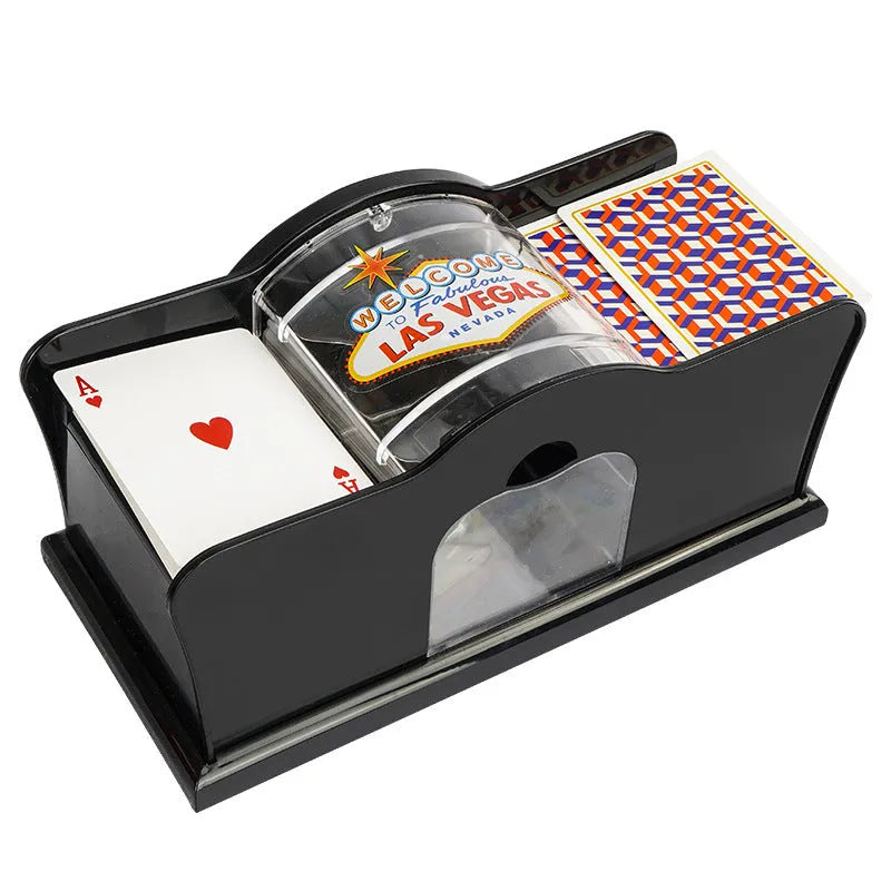 Manual card shuffler with hand crank mechanism on table with playing cards