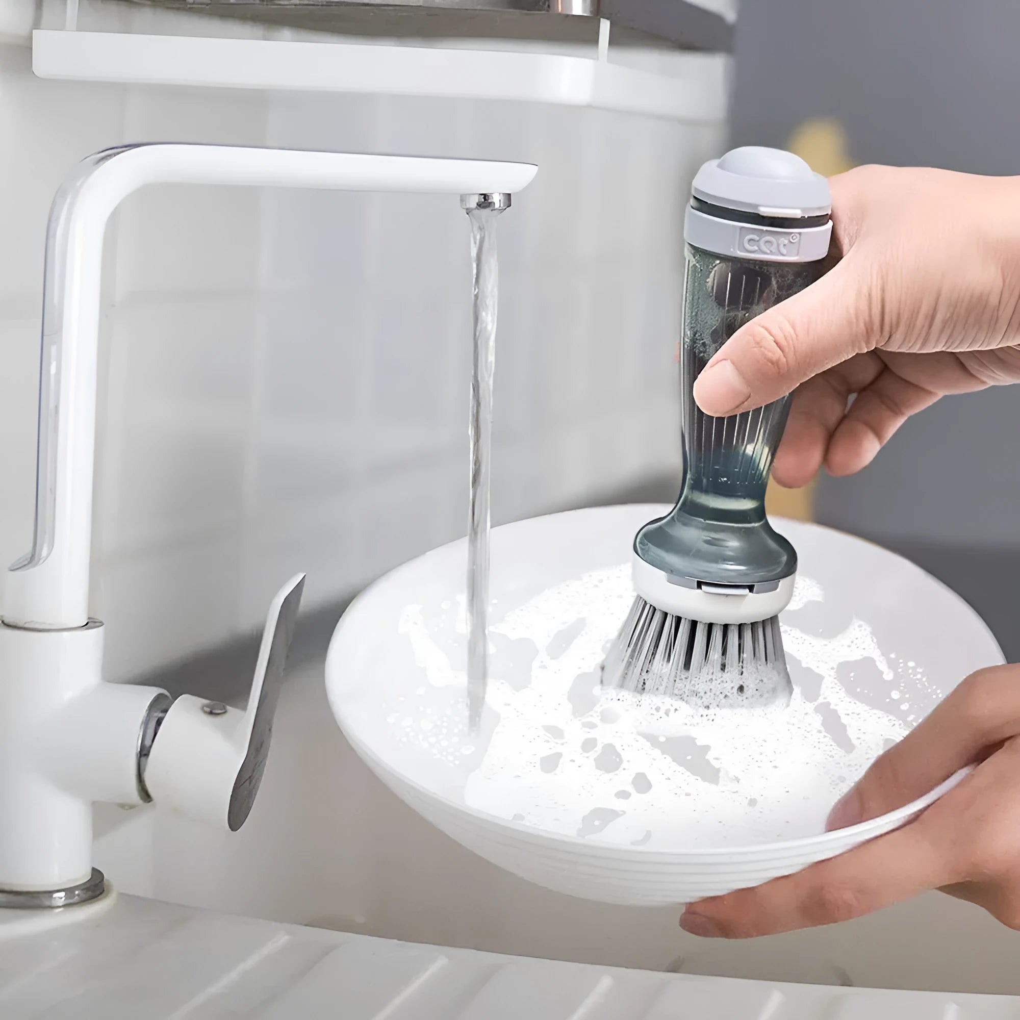 Milk white and mint green pot brush with integrated soap dispenser and replaceable head.