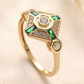 Square-cut emerald green gemstone ring on a finger, showing geometric ins-style design.