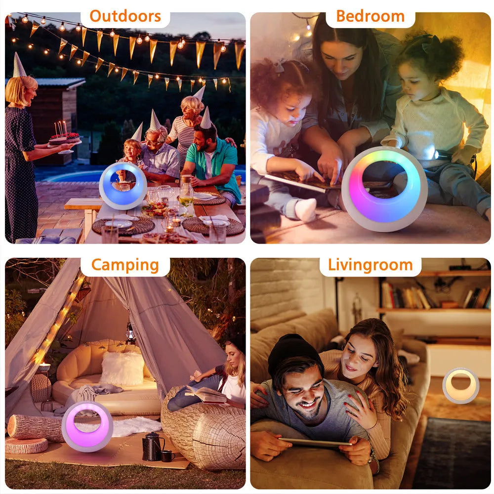 Small white RGB colour changing night lamp with remote control on a wooden desk.
