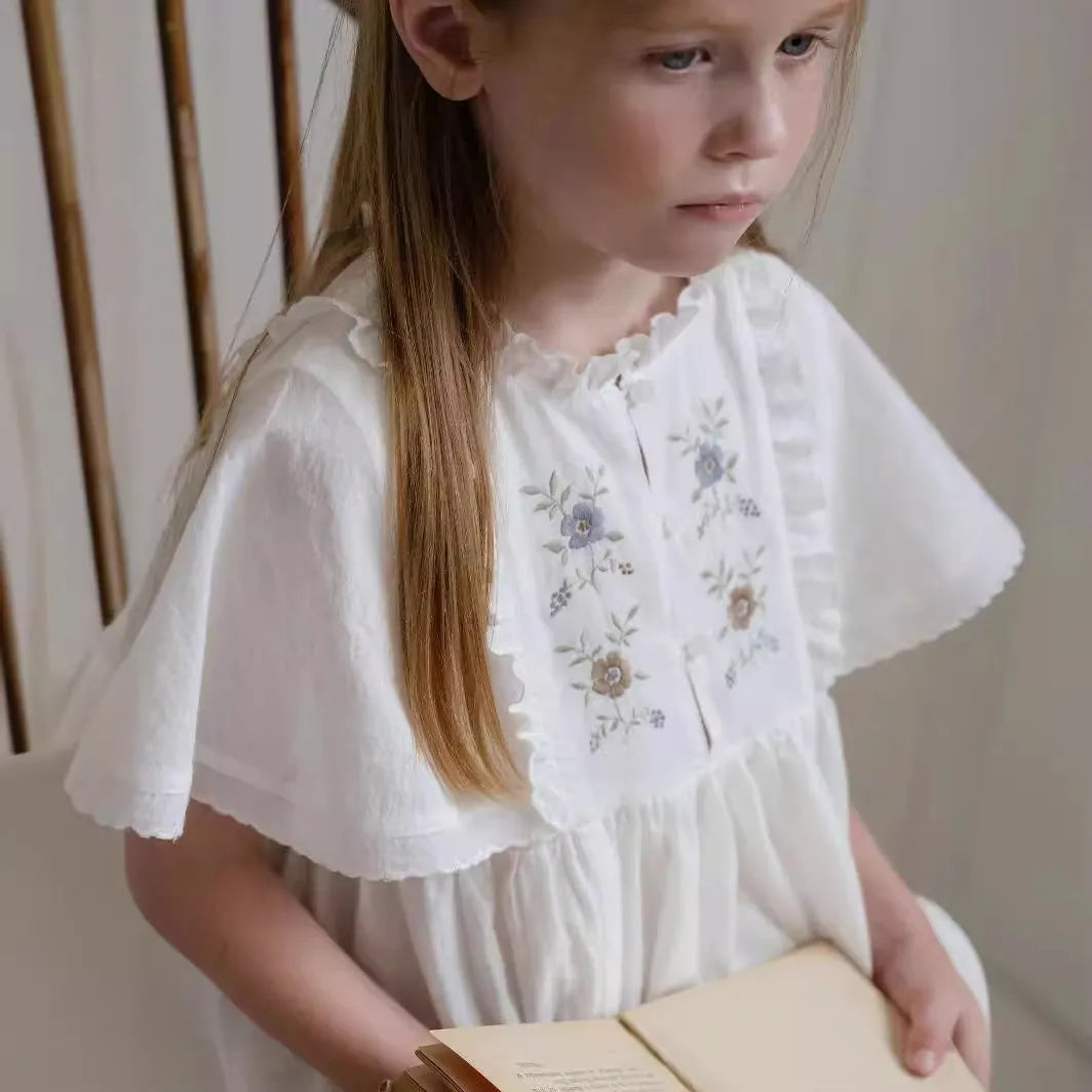 Girls white cotton summer dress with short ruffled sleeves and embroidered skirt detail