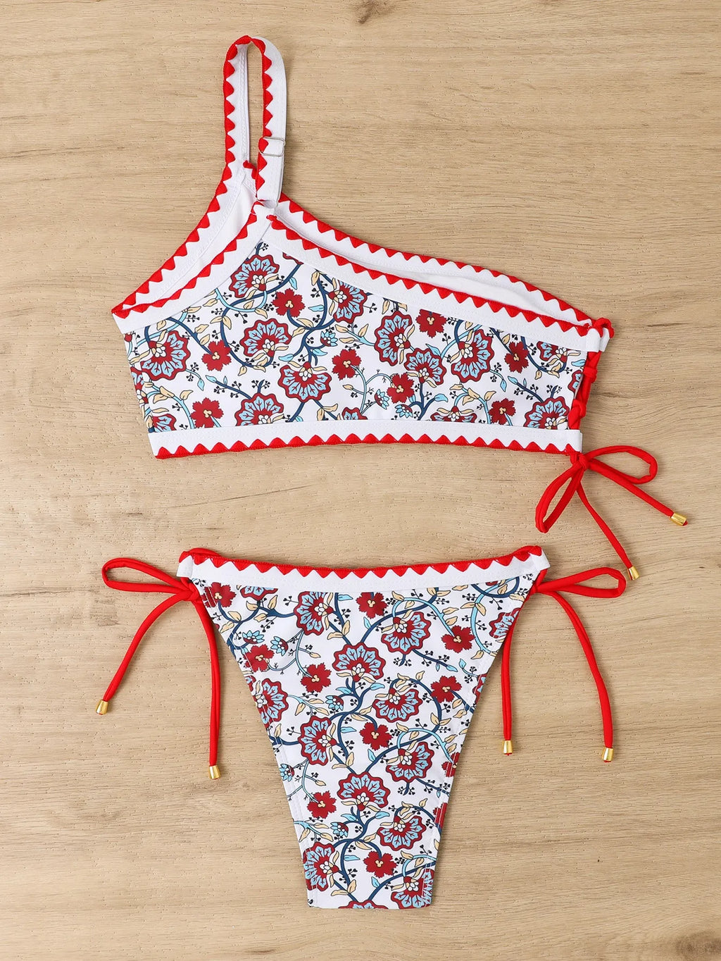 Blue one-shoulder women's floral bikini set with brief bottoms on mannequin