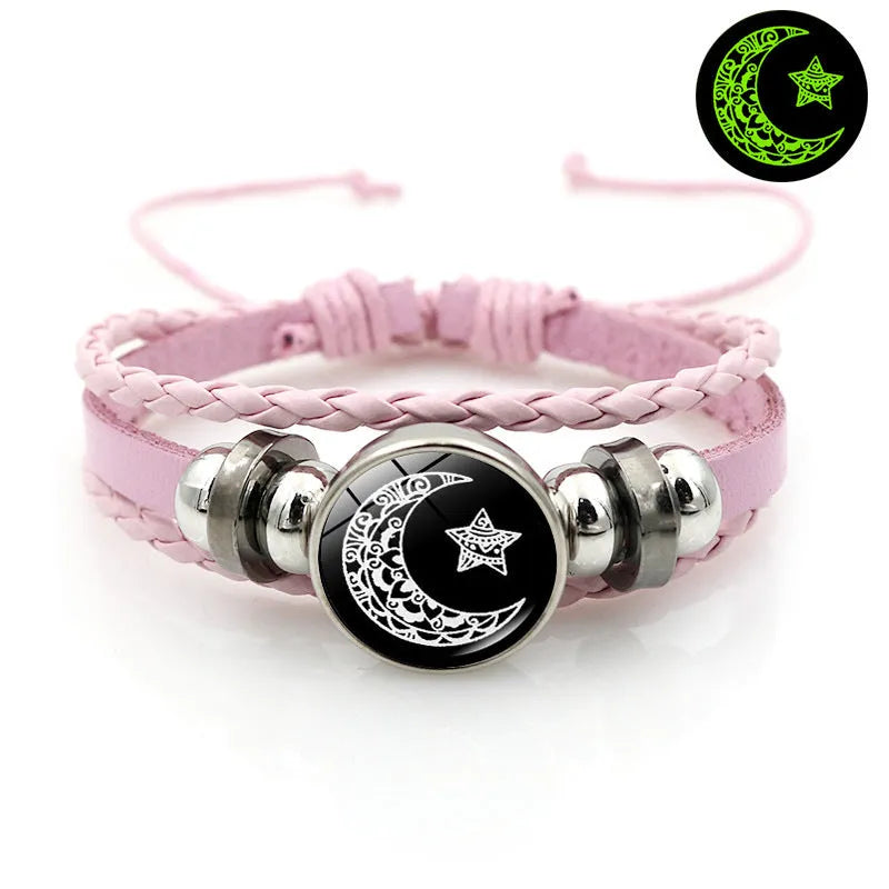 Luminous sun and moon couple leather bracelet on black background, showing glass pattern and adjustable chain