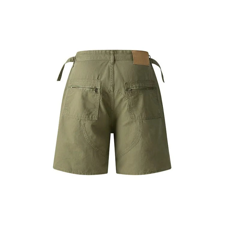 Retro loose-fit washed cotton shorts in camouflage colour on a neutral background.