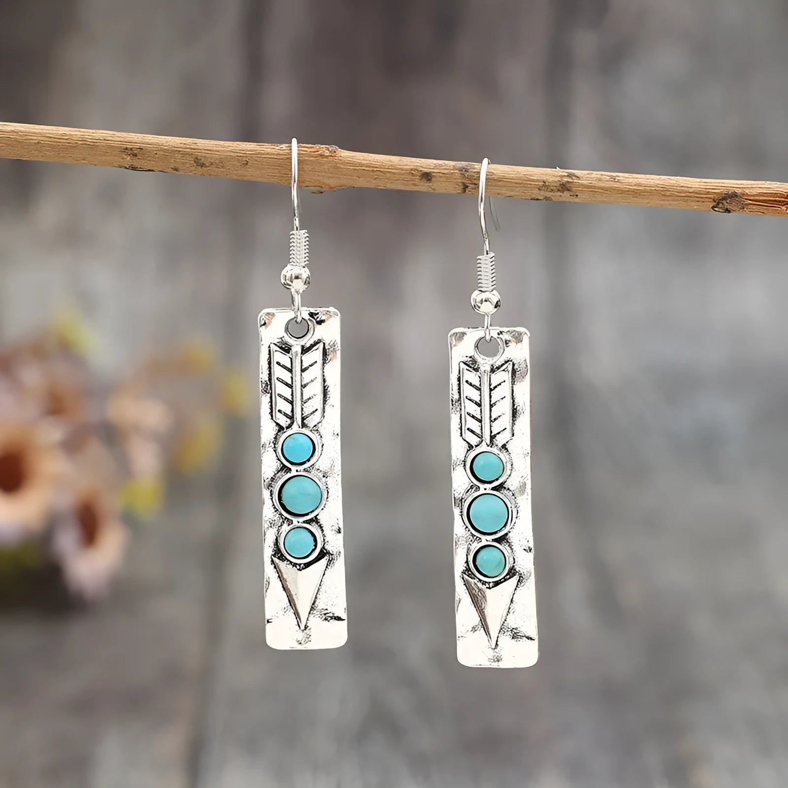 Silver geometric retro earrings with inlaid turquoise detail on zinc alloy