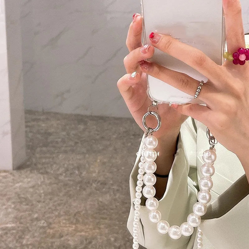 Soft silicone iPhone case with large pearl decoration and attached chain in Japanese Korean style