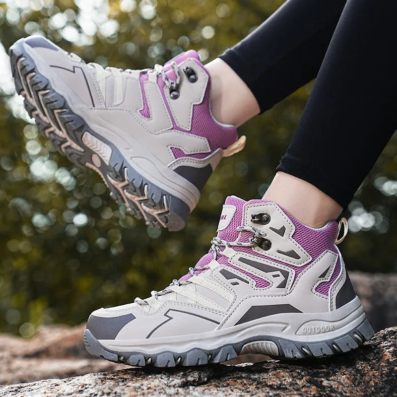 Low-top hiking sneakers in multiple colours on a rocky outdoor trail.
