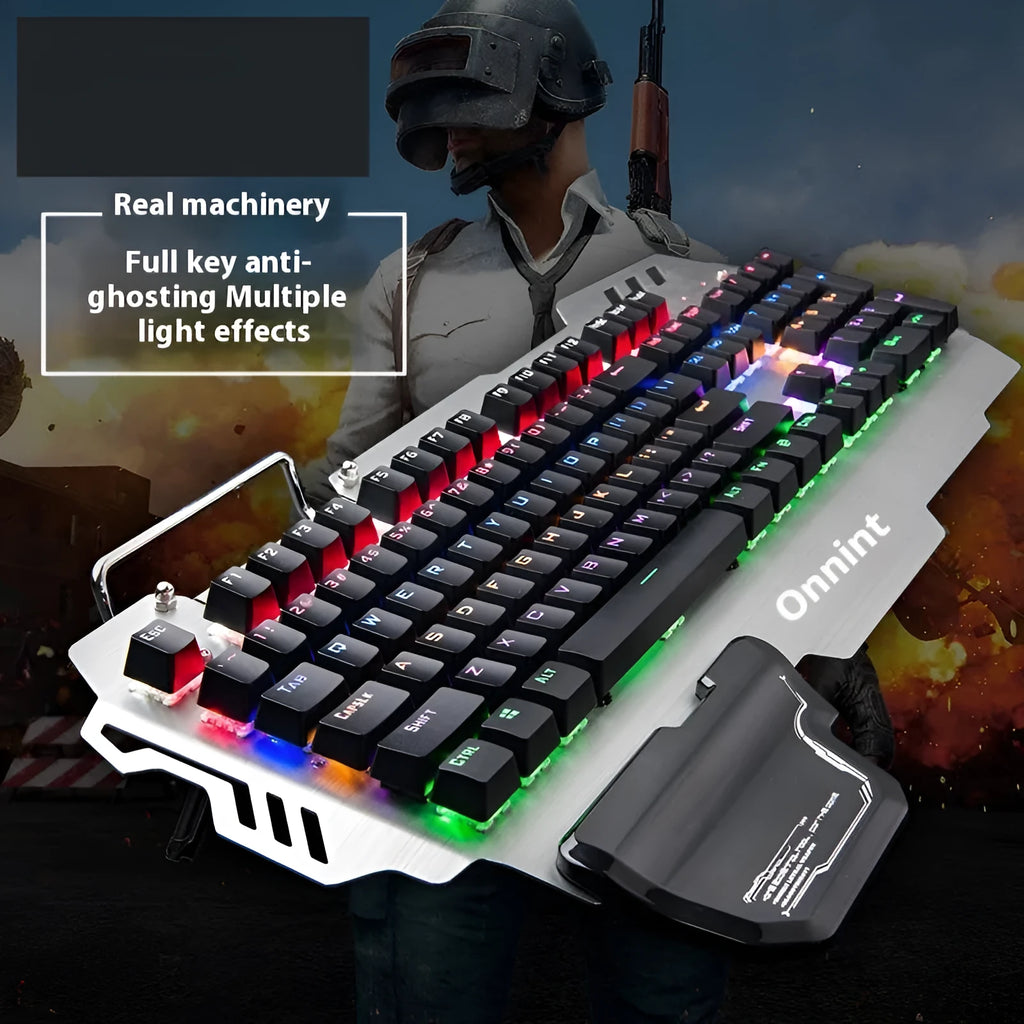 Silver metal panel professional gaming keyboard with built-in wrist splint on a desktop.