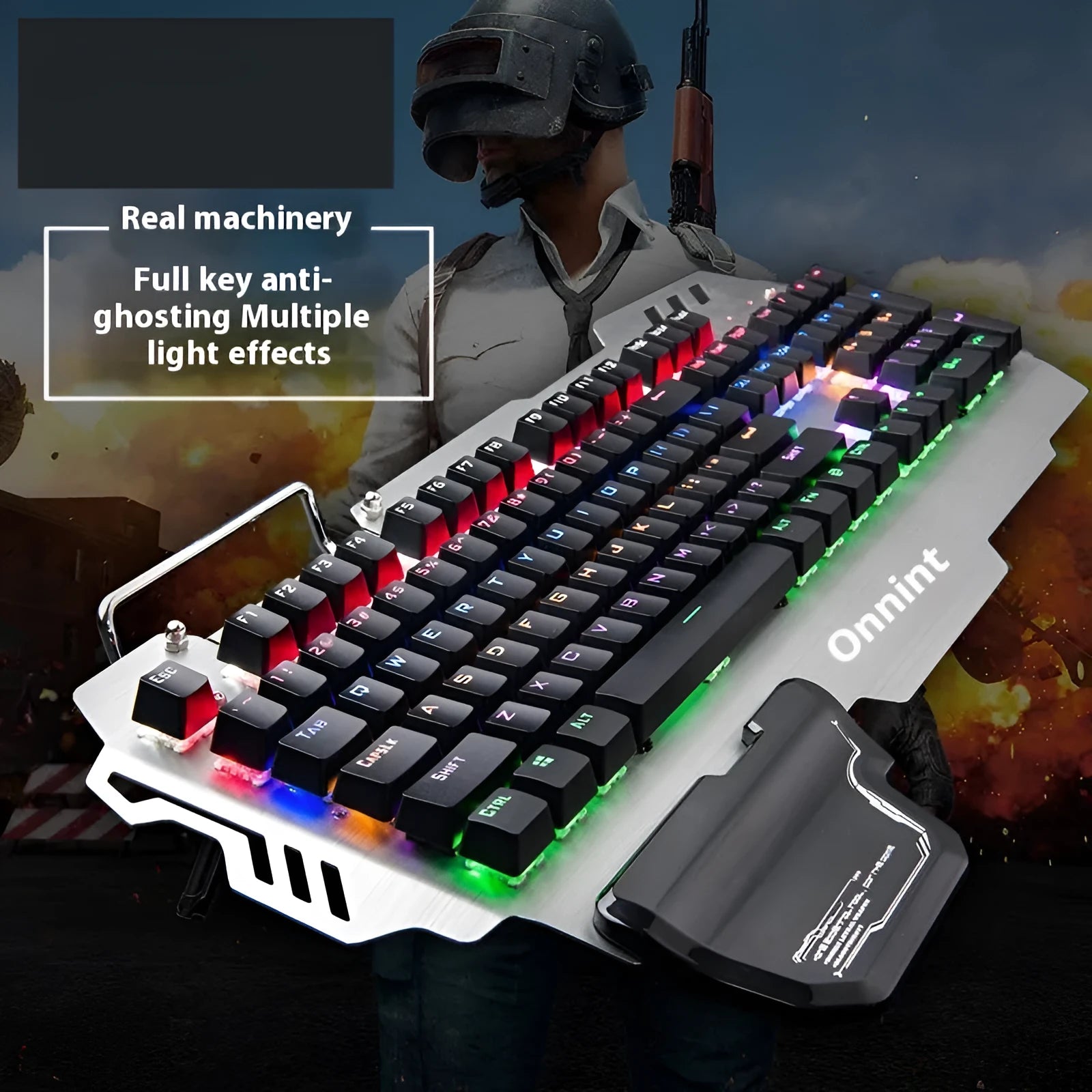 Silver metal panel professional gaming keyboard with built-in wrist splint on a desktop.