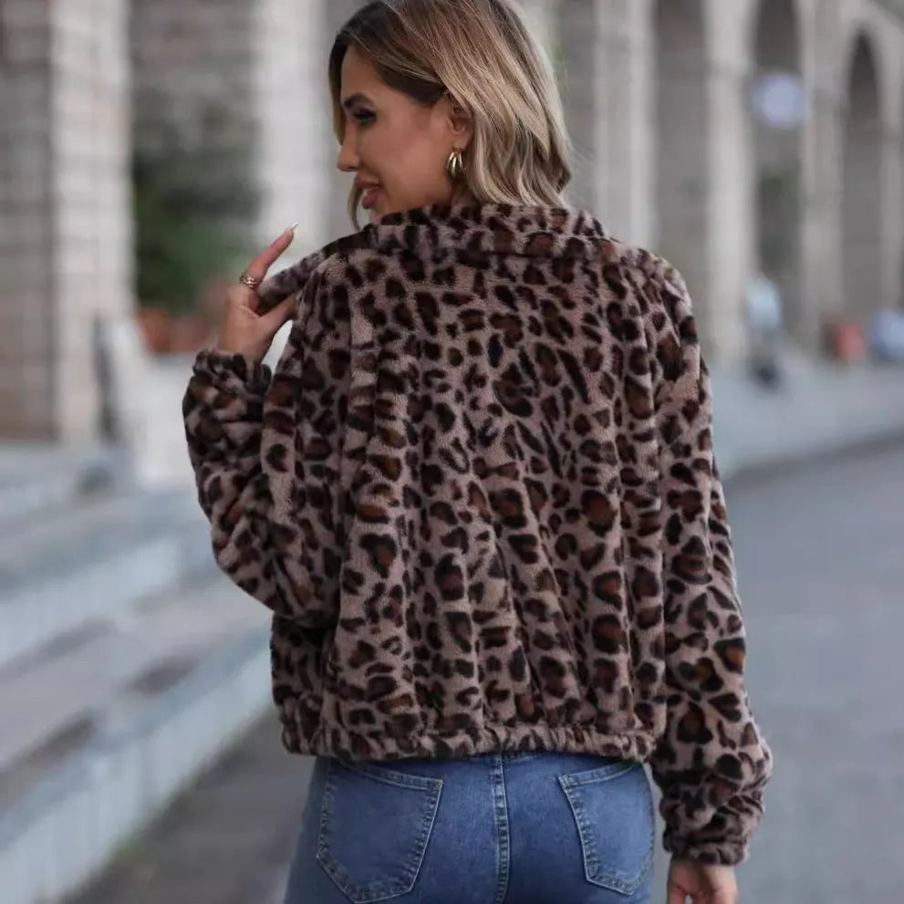 Women's loose leopard print plush coat with a zip front and raglan sleeves.