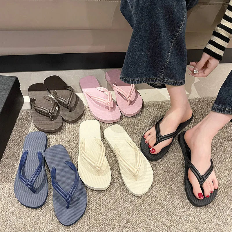 Men's casual PVC flip flops in beige with toe-covering design and textured non-slip sole.