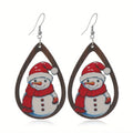 Wooden Christmas earrings with printed Santa Claus designs in geometric shapes