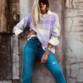 Lilac plaid print loose sweater with long sleeves and ribbed cuffs.